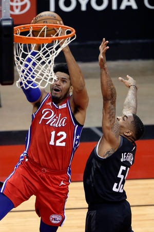 Tobias Harris (12) scores over DaQuan Jeffries during the Sixers easy win over the Rockets on Wednesday.