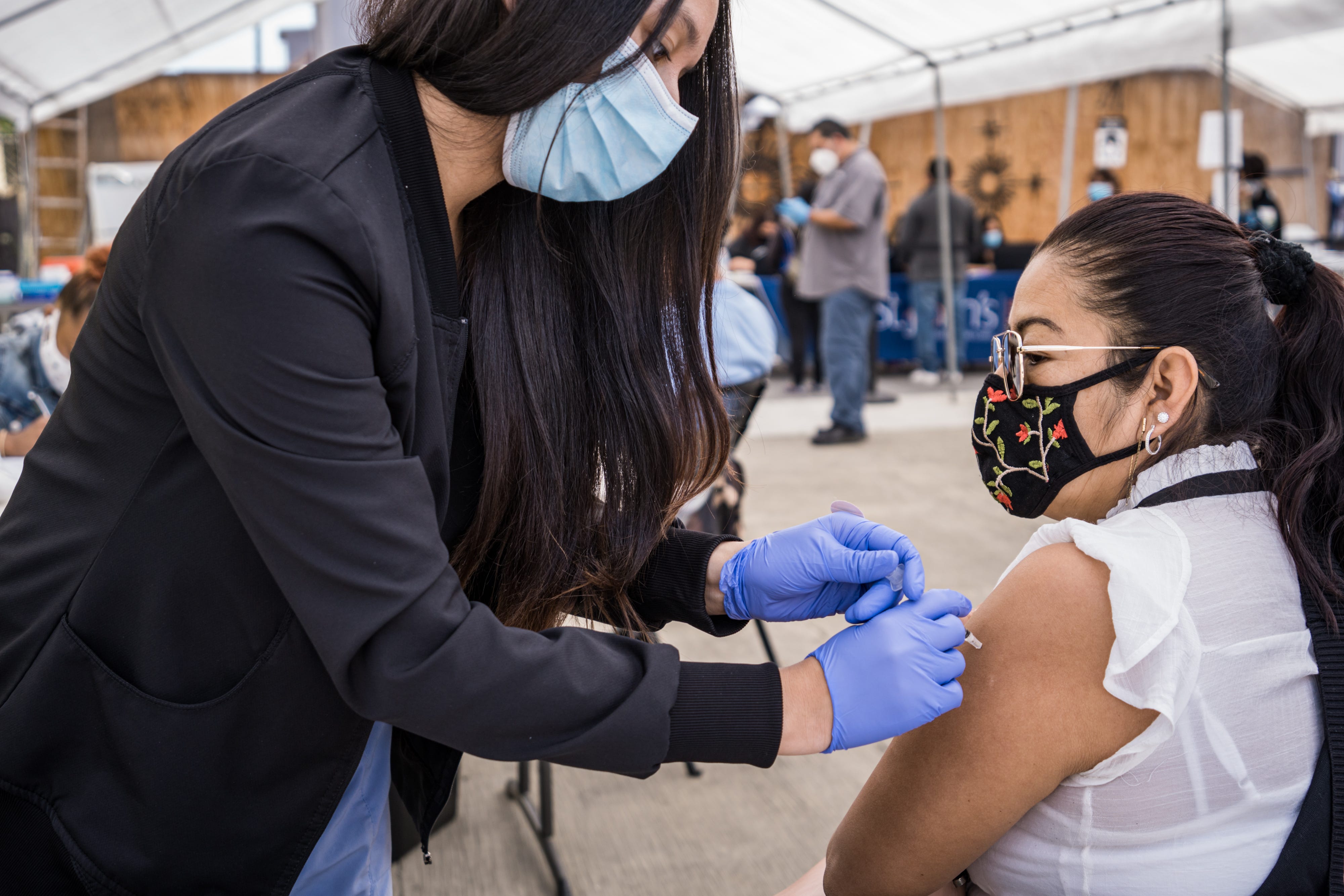 Community members getting vaccinated on April 10, 2021, at a CIELO mobile vaccination site in collaboration with St. Johns Well Child & Family Center in Los Angeles, California. CIELO is creating vaccine outreach videos in Indigenous languages to reach more immigrant communities.