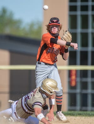 Washington's Easton Harris throws to first base on a double play against Dunlap on Wednesday, May 5, 2021 at Dunlap High School.