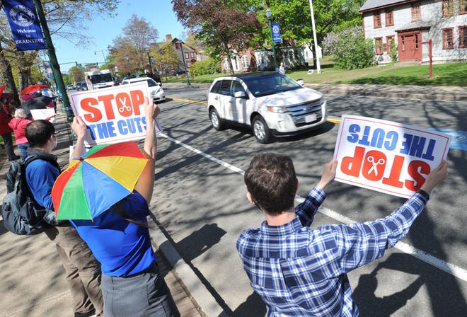 Teachers and parents line Washington Street at Braintree Town Hall to protest proposed cuts to the district's teaching staff, Thursday, May 6, 2021. Tom Gorman/For The Patriot Ledger