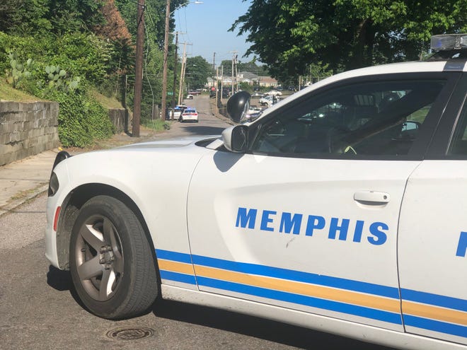 Memphis police officers block off Dunlap St., north of Poplar where Alcohol, Tobacco and Firearms agents and MPD officers were allegedly shot at by four suspects sending two law enforcement officers to the hospital with non-critical injuries.