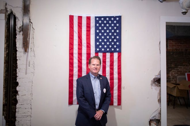 Sen. Joey Hensley, R-Hohenwald, poses in front of an American flag inside the Maury County Republican Party headquarters in Columbia, Tenn., on Saturday, May 30, 2020.