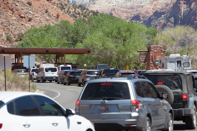 Visitors line up at the entrance to Zion National Park Thursday, May 6, 2021. 