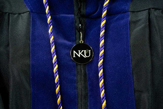 Shelby Bishop, of Independence, wears her gown and honor cord during the Northern Kentucky University Chase College of Law commencement at BB&T Arena, Friday, May 7, 2021 in Highland Heights, Kentucky. 
