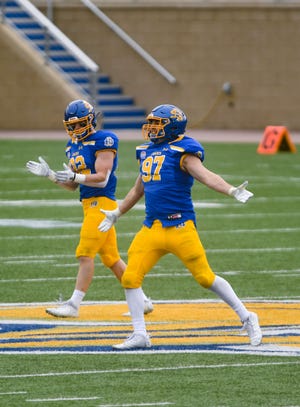 South Dakota State's Reece Winkelman celebrates after sacking Delaware's quarterback during the FCS semifinals on Saturday, May 8, 2021 at Dana J. Dykhouse stadium in Brookings.