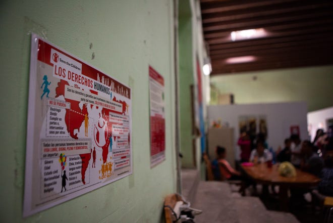 Posters on the walls of El Buen Samaritano shelter remind migrants of their rights. (Corrie Boudreaux/El Paso Matters)
