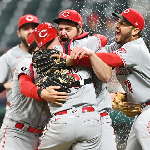 Reds starter Wade Miley, center, and catcher Tucke