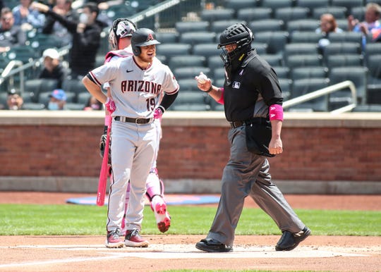 May 9, 2021; New York City, New York, USA;  Arizona Diamondbacks second baseman Josh VanMeter (19) argues with home plate umpire Manny Gonzalez (79) after being called out on strikes in the first inning against the New York Mets at Citi Field. Mandatory Credit: Wendell Cruz-USA TODAY Sports