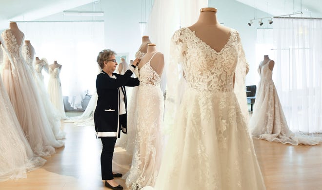 "We're used to surviving, and we're used to doing what it takes," Sue Rosenberger of Fantastic Finds says Thursday, April 22, 2021, about her shop in Lansing Township that specializes in wedding gowns, dresses, suits, and tuxedo rental.