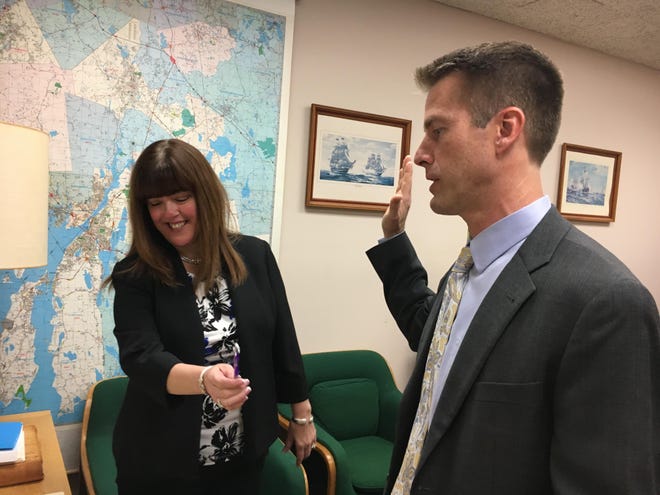 Business consultant Alan Rumsey is sworn in by town clerk Allison Bouchard in this file photo dated Jan. 6, 2020.