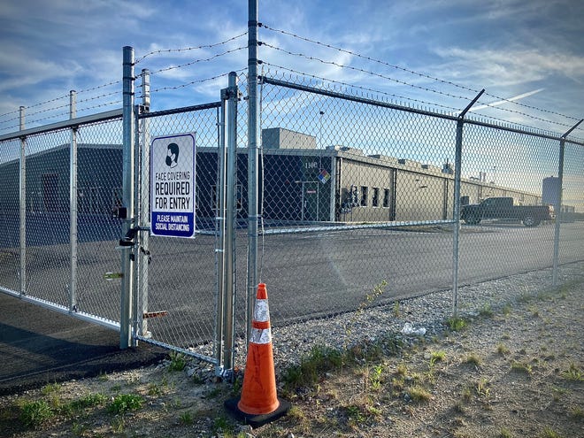 What was described on the Innovation Way as a health-for-life marijuana grow facility has yet to be opened and is fenced off behind barbed wire.