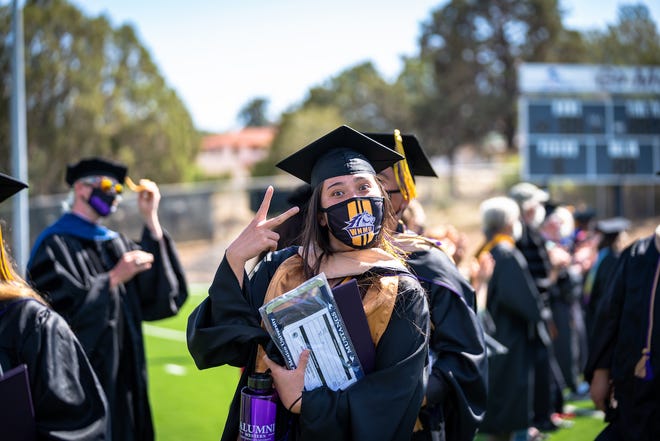 Spring 2021 Western New Mexico University Student Hall of Fame inductee Kelli McGhiey proceeds into Ben Altamirano Stadium ahead of Friday’s hybrid commencement ceremony.