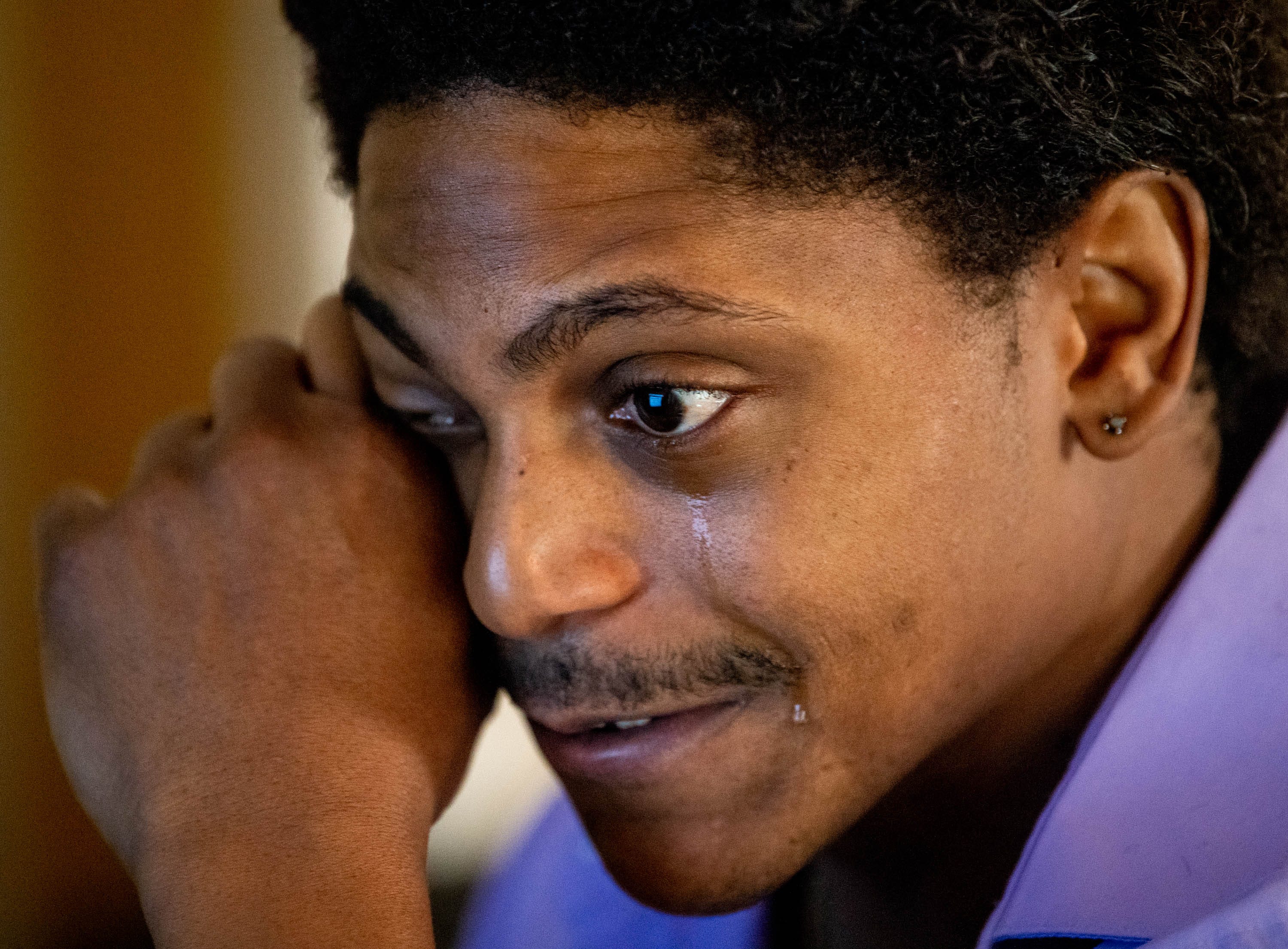 Kendrick Harrison wipes away tears while recounting when he found out Argosy University was closing. The for-profit college closed after the U.S. Department of Education pulled federal funding, leaving Harrison and other students without many options to recoup money the school pocketed.