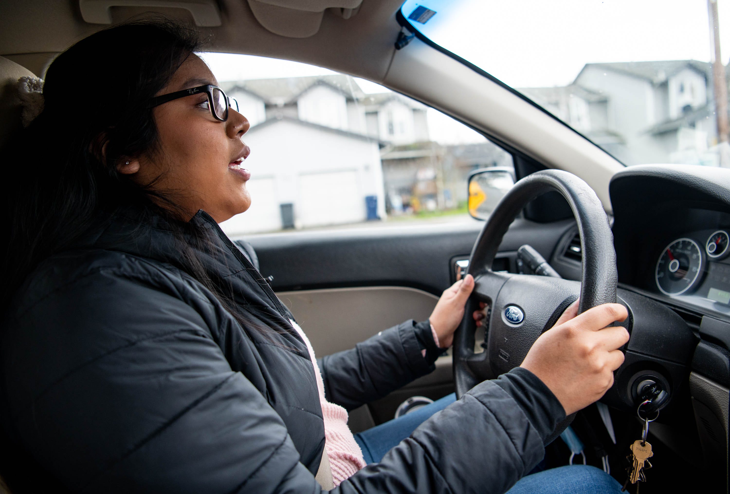 Guillermina Gutierrez-Martinez talks about her upbringing while driving around her hometown, on Friday, March 19, 2021, in Mount Vernon, Wash.