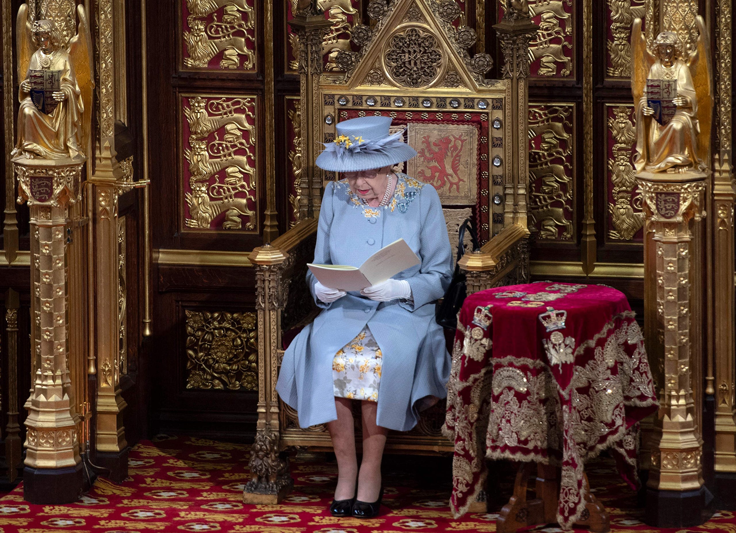 Queen Elizabeth II reads the Queen's Speech on the The Sovereign's Throne in the House of Lords during the State Opening of Parliament in London on May 11, 2021.