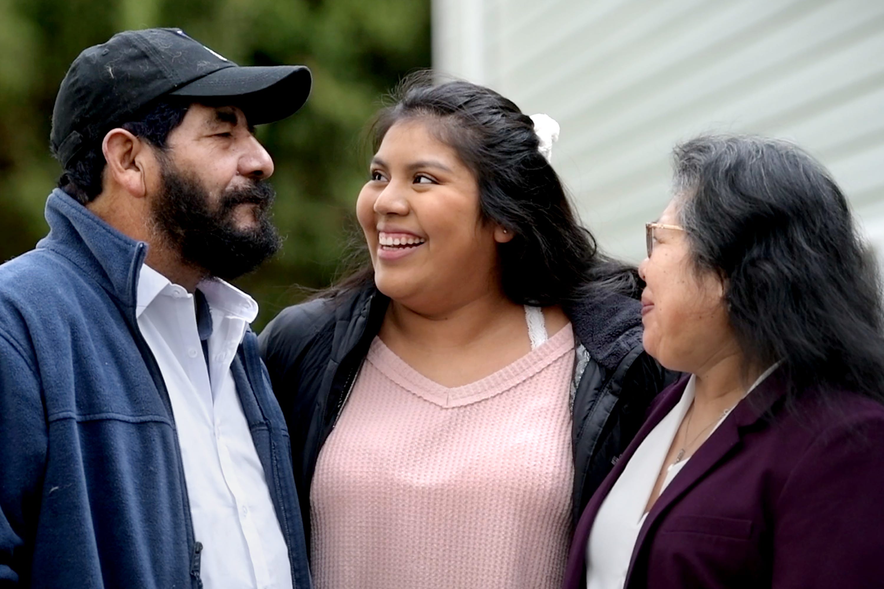 Guillermina Gutierrez Martinez, center, has often said she is pursuing a college degree for her parents, Felipe Gutierrez and Carmen Martinez Medina. But over the last year, she's realized "I want it for me, too."