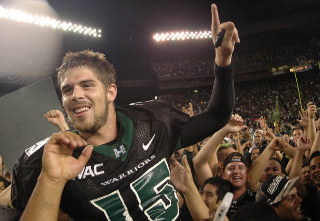 Colt Brennan (15) celebrates after defeating Boise State 39-27 in their college football game in Honolulu, in this November 23, 2007 photo.