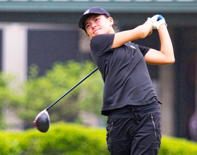 Vandegrift senior Mimi Burton, hitting a tee shot at the state tournament last year in Georgetown, said she enjoys skiing as much as golf. Her dad, though, cut out ski trips, fearing she would be injured.