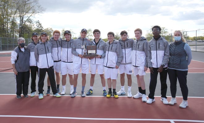 The Quaker tennis team poses for a photo with their trophy after defeating South Park and claiming the WPIAL Class 2A Tennis Championship Wednesday evening at North Allegheny High School.