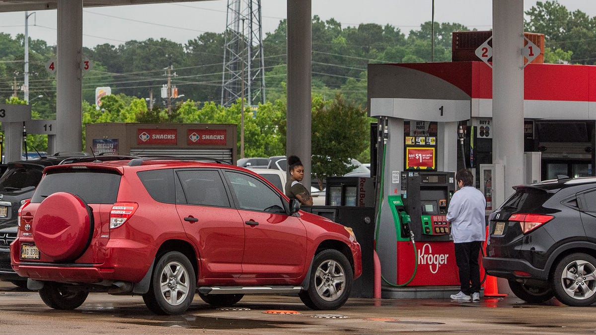 Drivers line up to fill their tanks with gas at the Kroger station on I-55N frontage Road in Jackson, Miss., Tuesday, May 11, 2021, after a ransomware attack Friday, May 7, 2021, shutdown the Colonial Pipeline, a critical artery for gasoline in the southeastern United States.