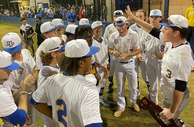 Newberry pitcher Luke Ridley (3) tells his teammates they are now two wins away from a state championship, after beating rival Williston Tuesday night 12-6 in the Region 4-Class 1A Final.