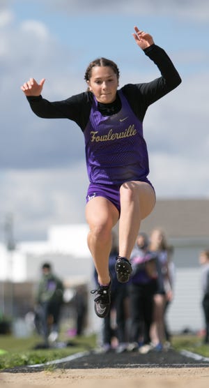 Sarah Litz of Fowlerville won the long jump with a 14-10 effort against St. Johns on Tuesday, May 11, 2021.