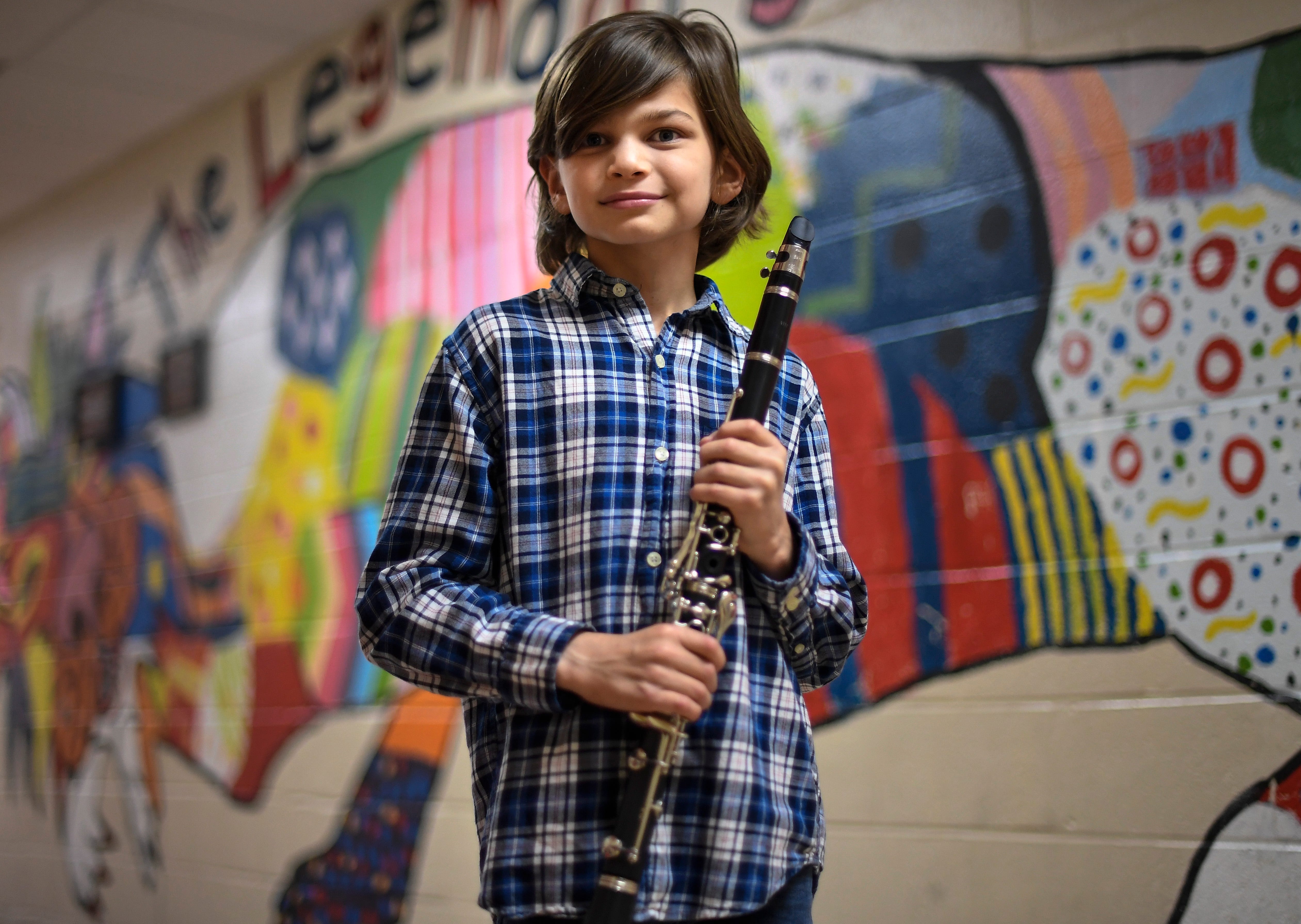 Max Pulle holds his clarinet before his fifth-grade band concert — the first in-person school event of the school year — at Isaac Litton Middle School May 11 in Nashville, Tenn.