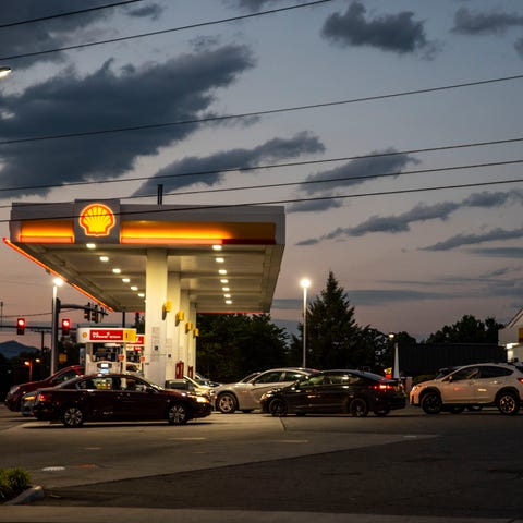 Drivers line up for fuel at a Shell Gas Station on