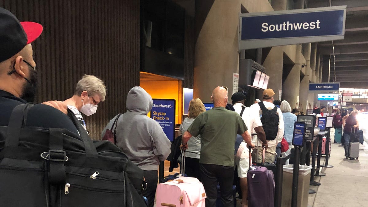 Southwest Airlines passengers in line for curbside check-in at Phoenix Sky Harbor International Airport in May.