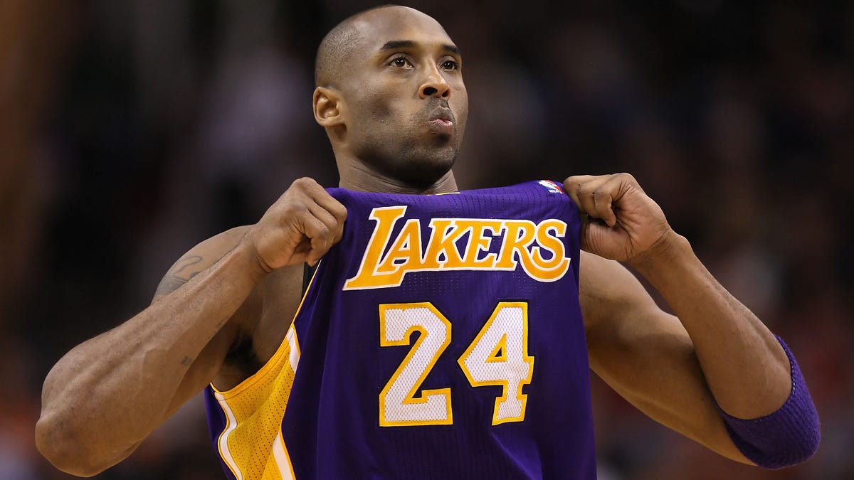 FILE - APRIL 4, 2020: Players Kobe Bryant, Kevin Garnett, Tim Duncan and Tamika Catchings and coaches Rudy Tomjanovich, Kim Mulkey, Barbara Stevens and Eddie Sutton have been selected as the 2020 inductees into the Naismith Memorial Basketball Hall of Fame. PHOENIX, AZ - FEBRUARY 19:  Kobe Bryant #24 of the Los Angeles Lakers adjusts his jersey during the NBA game against the Phoenix Suns at US Airways Center on February 19, 2012 in Phoenix, Arizona. The Suns defeated   the Lakers 102-90. NOTE TO USER: User expressly acknowledges and agrees that, by downloading and or using this photograph, User is consenting to the terms and conditions of the Getty Images License Agreement.  (Photo by Christian Petersen/Getty Images) ORG XMIT: 136214769 ORIG FILE ID: 139369178