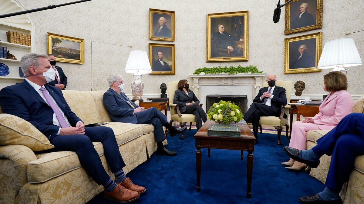 President Joe Biden speaks during a meeting with congressional leaders in the Oval Office of the White House, Wednesday, May 12, 2021, in Washington. From left, House Minority Leader Kevin McCarthy of Calif., Senate Minority Leader Mitch McConnell of Ky., Vice President Kamala, Biden, House Speaker Nancy Pelosi of Calif., and Senate Majority Leader Chuck Schumer of N.Y.