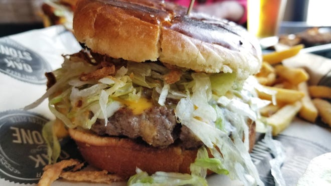 Oak & Stone, with multiple locations in Southwest Florida, serves the Griddle Burger.