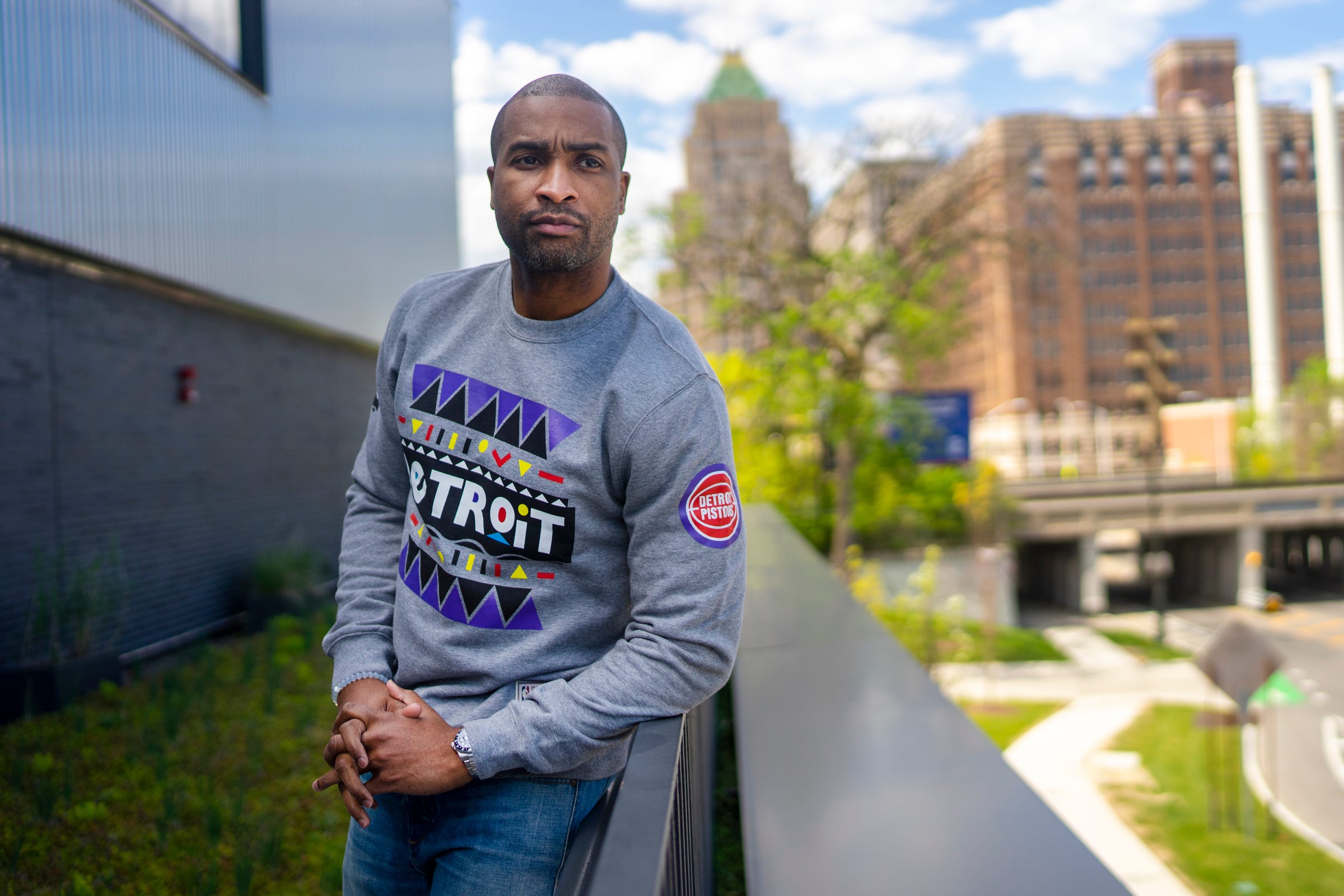 Will Bradford poses for a portrait wearing a sweater from the limited edition Pistons x Martin Merchandise Line at the Pistons Performance Center on Thursday, May 13, 2021, in Detroit.