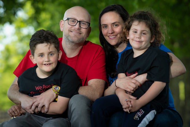 Steven Komarnitsky poses with his wife, Samantha, daughter, Colette, 5, and son, Nash, 7, Wednesday, May 12, 2021, in Franklin, Tenn. He and his family are opening a We Rock The Spectrum Kids Gym that will serve children of all abilities.