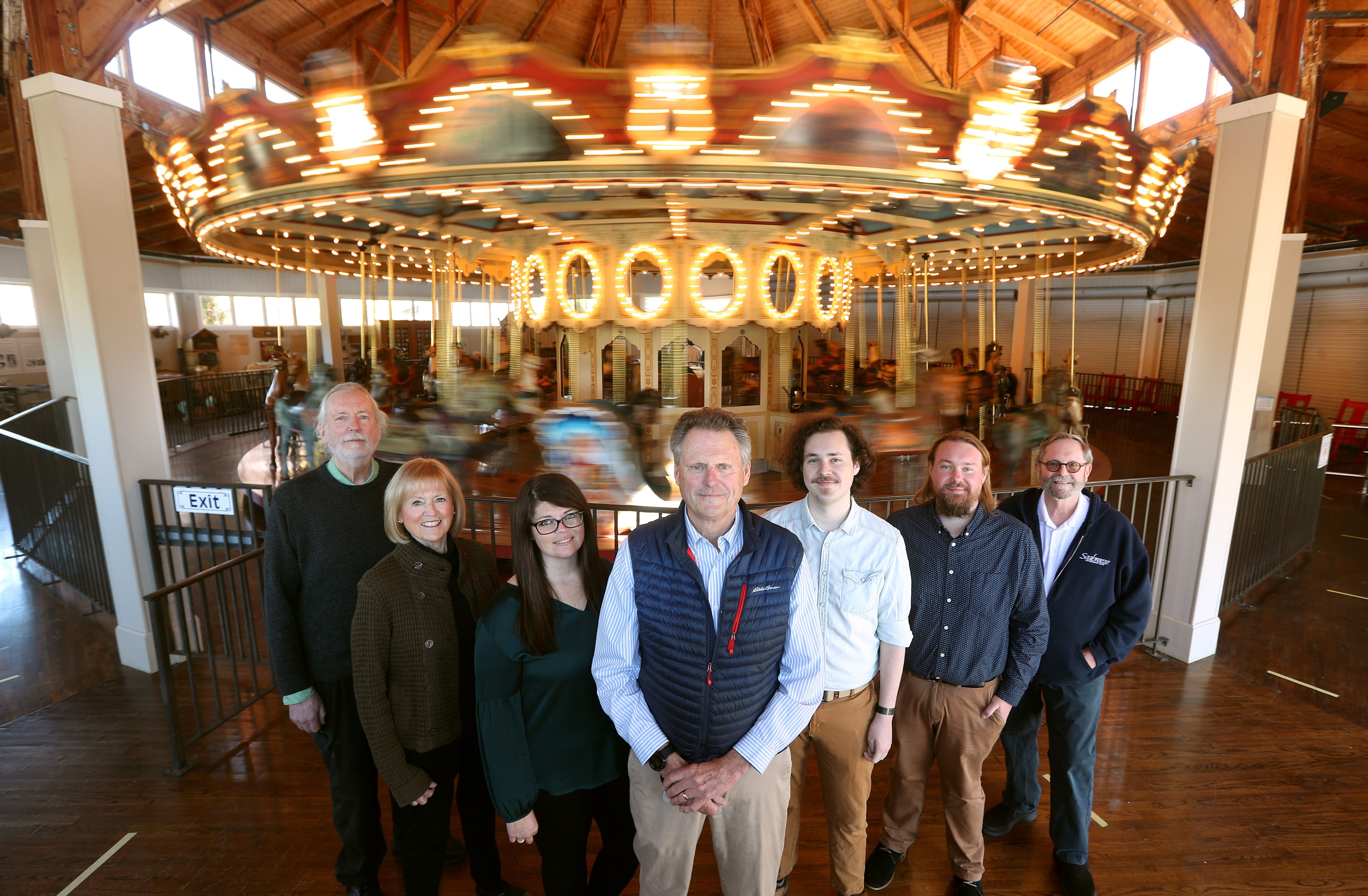 The Norris (Long) family has operated Seabreeze Amusement Park since 1937. From left are, George Norris, Anne Norris, Genevieve Norris-Brown, Rob Norris, Jack Norris, Alex Norris and John Norris, pictured at the iconic carousel. The families' grandfather George Long Jr. began operating the park in 1937 and bought the park in 1946, changing the name to Dreamland Park.