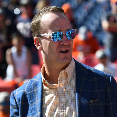 Peyton Manning watches a Denver Broncos game in 20