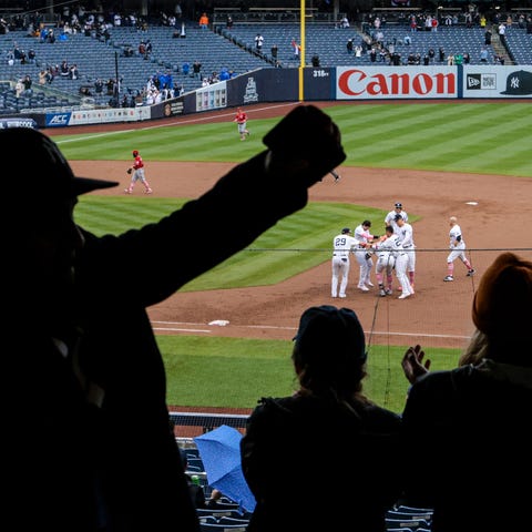 Yankees players celebrate after a win against the 