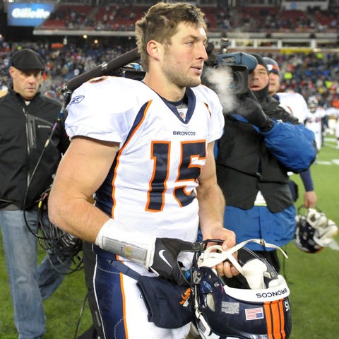Ex-Broncos QB Tim Tebow walked off the field after