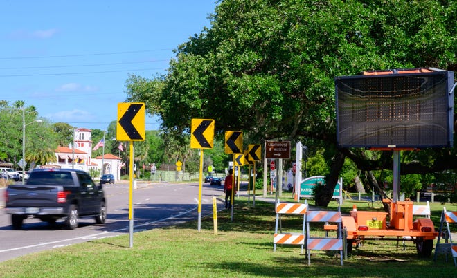 A mobile sign urges motorists on Anastasia Boulevard to slow as they approach Red Cox Drive in St. Augustine on Friday.