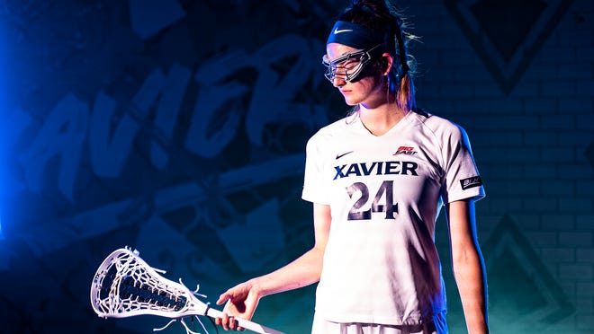 Xavier University is adding women's lacrosse as its 19th Division I sport beginning with the 2022-23 academic year. Pictured here in lacrosse gear is Hunter Fry, a Xavier women's volleyball player from Indian Hill High School.
