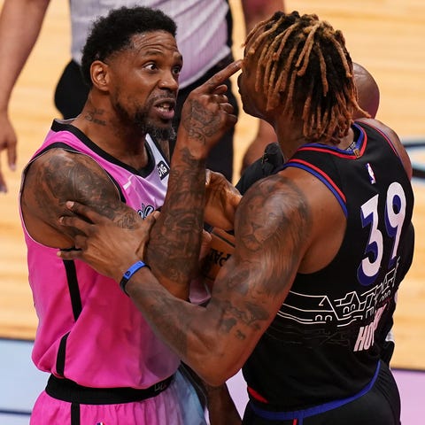 Udonis Haslem (40) and Dwight Howard (39) exchange