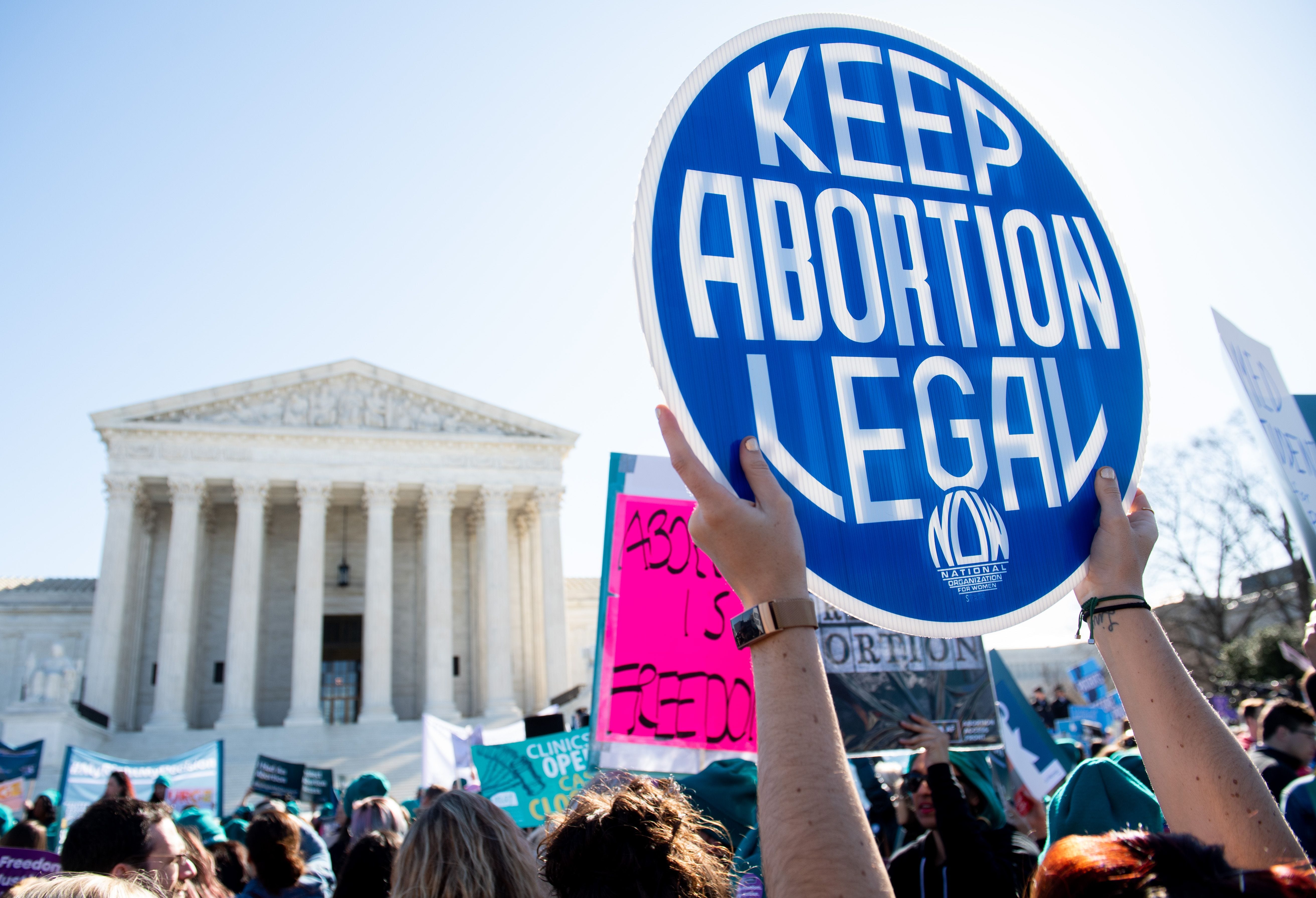Activists supporting legal access to abortion protest outside the Supreme Court on March 4, 2020, as justices hear oral arguments regarding a Louisiana law in the court's first major abortion case in years.