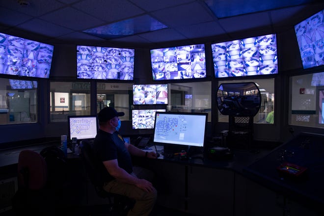 Officer Jarrod Rice keeps his eyes on the many camera feeds from the Control Tower at the Henderson County Detention Center Friday, May 14, 2021. Besides being able to view the inmates, Rice can also open and close doors throughout the 566-bed jail.