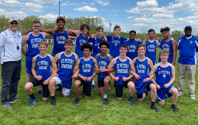 The St. Peter's boys track and field team poses for a photo after winning the Mid-Buckeye Conference title for the first time in school history on Saturday.