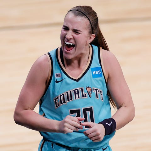 Sabrina Ionescu celebrates her last-second 3-point