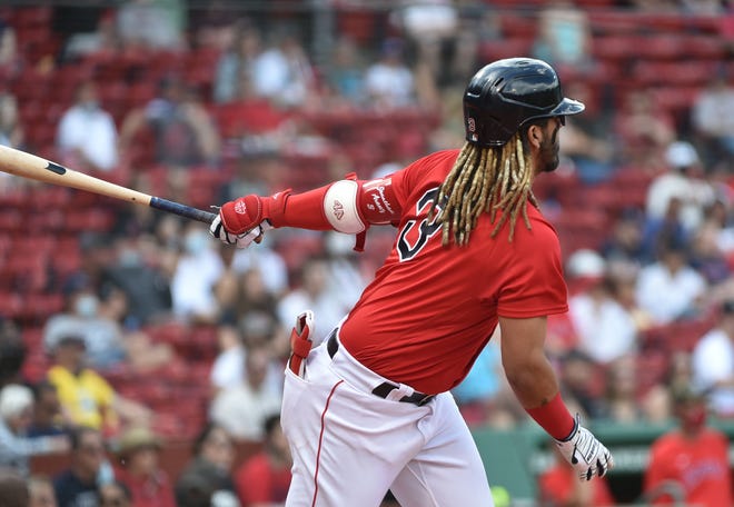 May 16, 2021; Boston, Massachusetts, USA;  Boston Red Sox shortstop Jonathan Arauz (3) hits an RBI double during the fourth inning against the Los Angeles Angels at Fenway Park. Mandatory Credit: Bob DeChiara-USA TODAY Sports