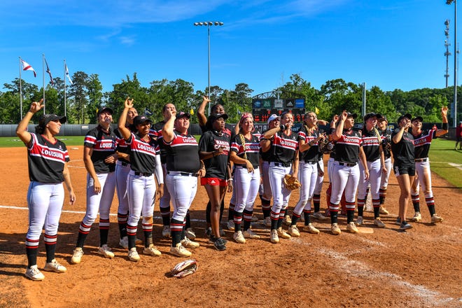 The No. 14 Ragin' Cajuns celebrate after their Sun Belt Conference Softball Tournament championship game win over South Alabama on Saturday in Troy, Alabama.