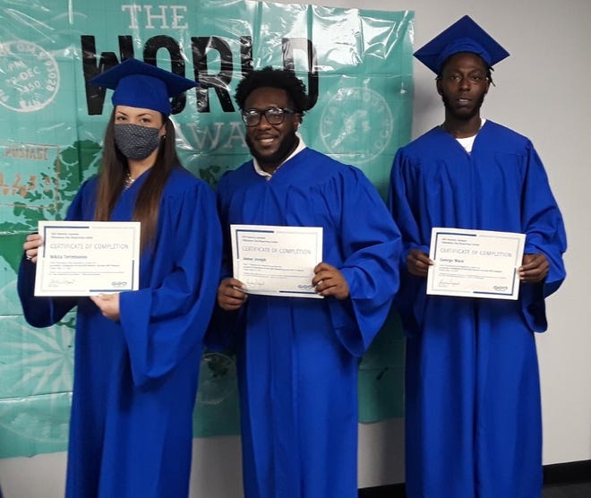 Nikita Terrebonne (from left), Jamar Joseph and George Ward display their diplomas during a ceremony Friday at the Thibodaux Day Reporting Center's re-entry program.