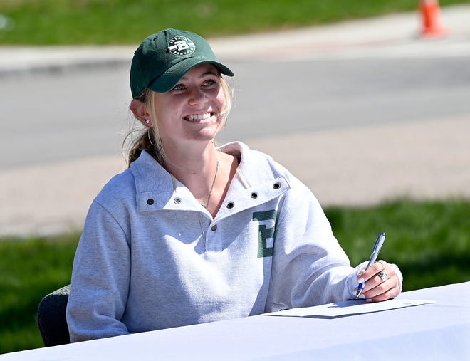 Millis' Abby Miller signs her National Letter of Intent to play basketball at Babson College at Millis High School, May 7, 2021. On Sunday, she ran a marathon around Millis to raise money for the Millis High athletic programs.