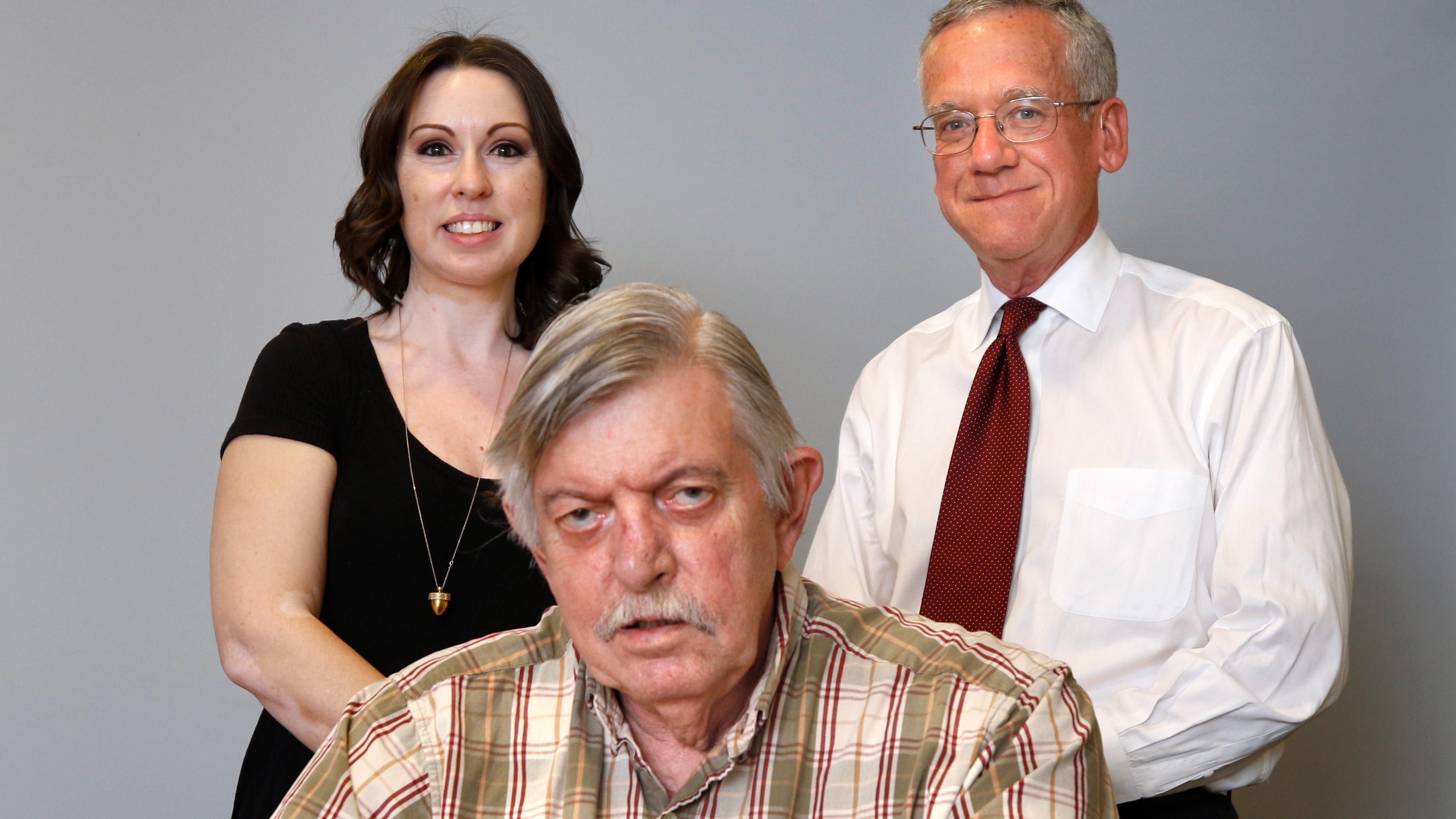 Edward Caniglia with lawyers Rhiannon Selina Huffman and Thomas W. Lyons III, whom he refers to as his "heroes."